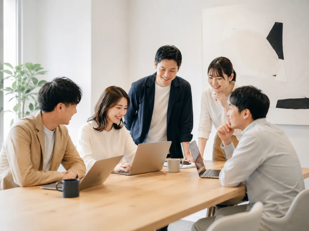 ノートPCを囲んで話し合う5人（イメージ画像・AI生成。DIRIGIOの実在のメンバーではありません）